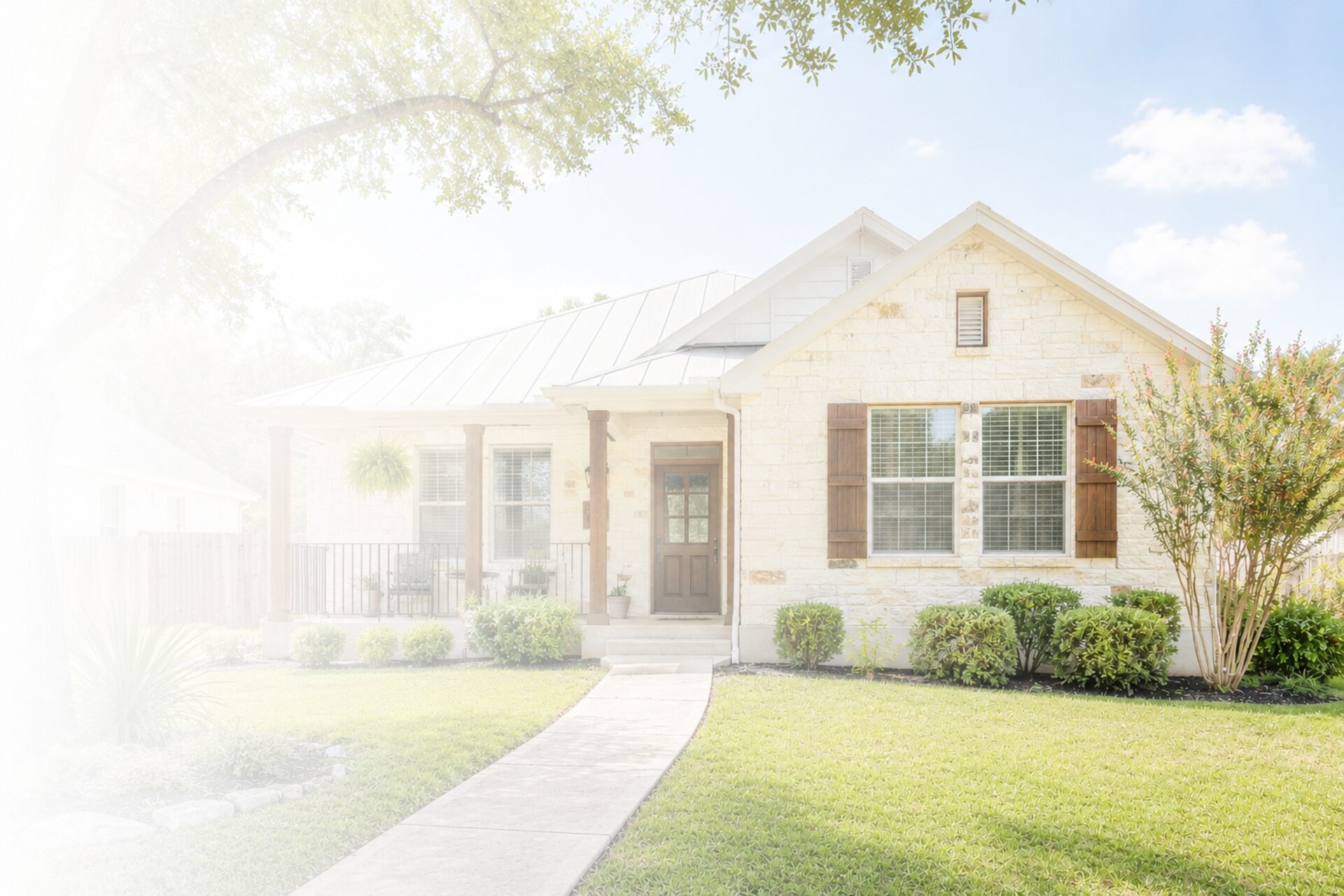Boerne, Texas stone home with metal roof — boutique Hill Country property management
